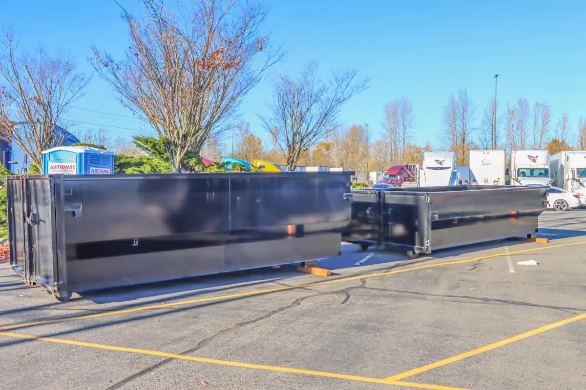 Professional dumpster rental service with roll-off container on residential driveway in Bithlo